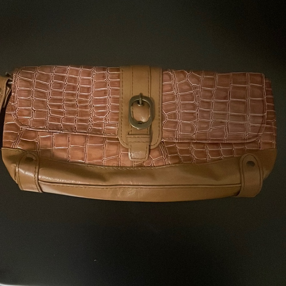 Brown clutch bag. Wrist strap can be used as wristlet. Used good condition